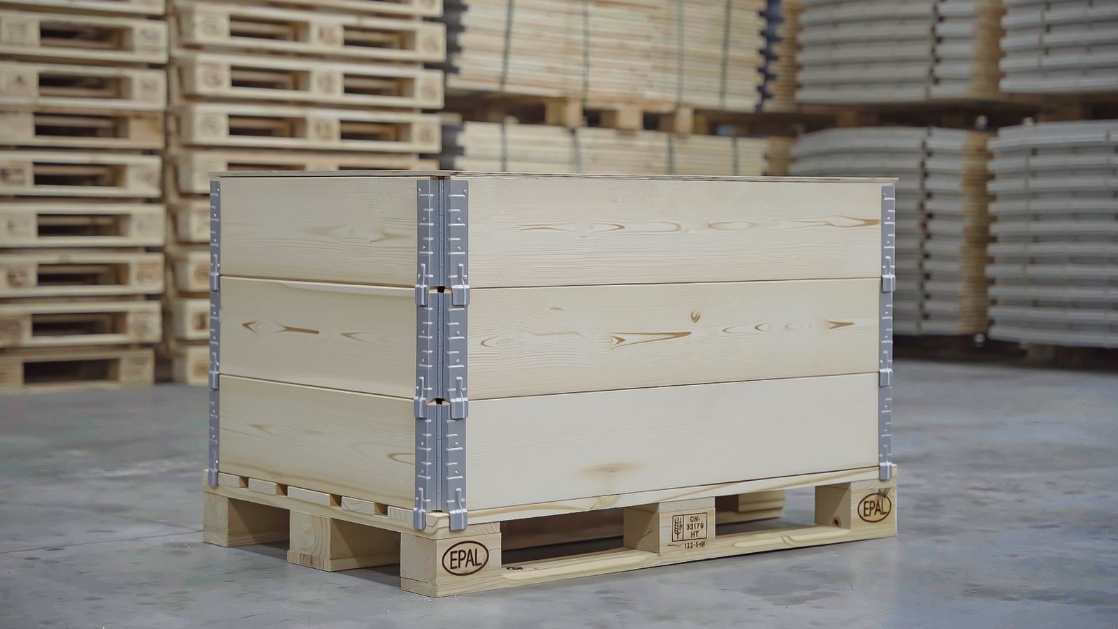 Three-tier pallet collar stack on EPAL pallet in warehouse