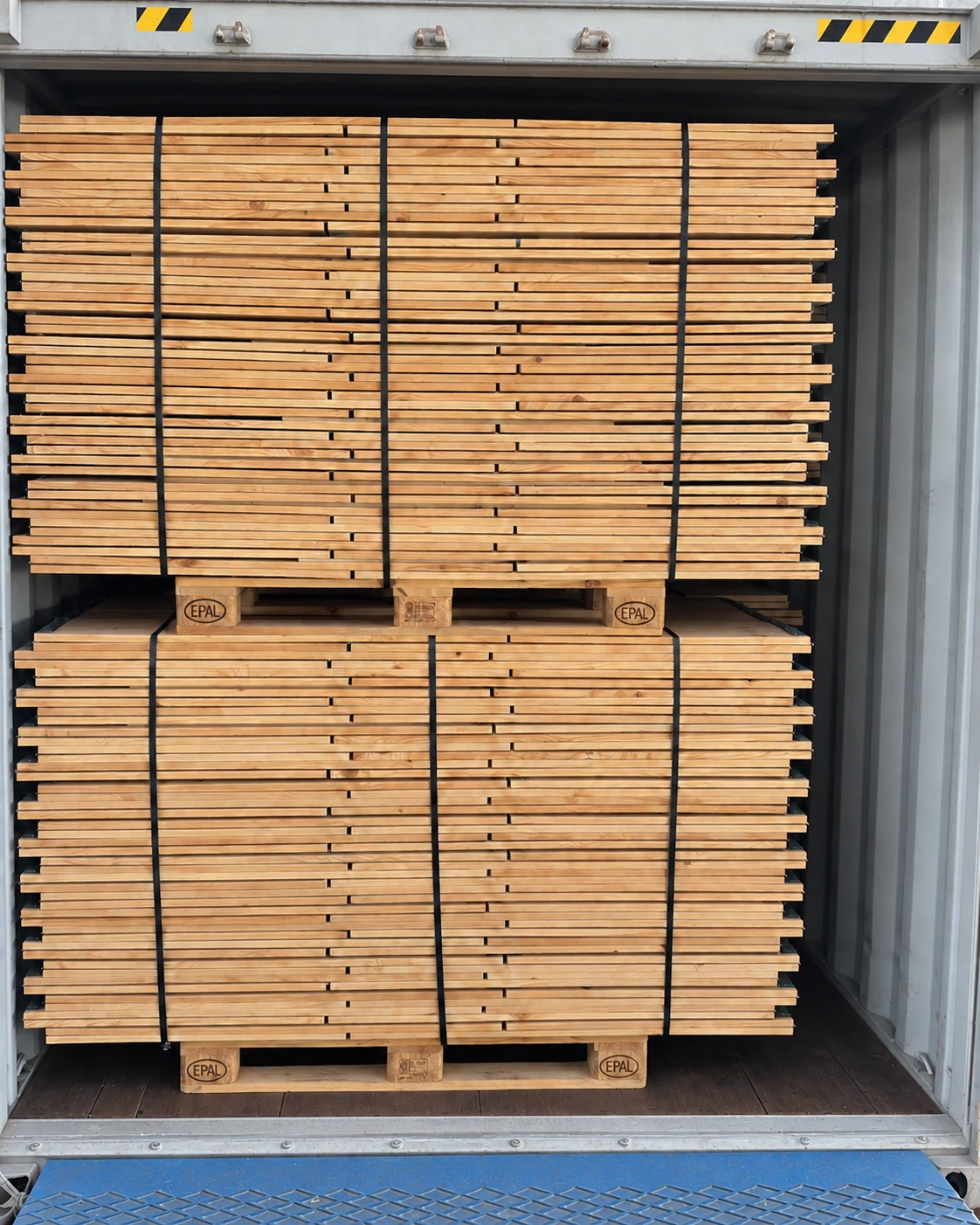 Folded pallet collars bundled and loaded in a shipping container